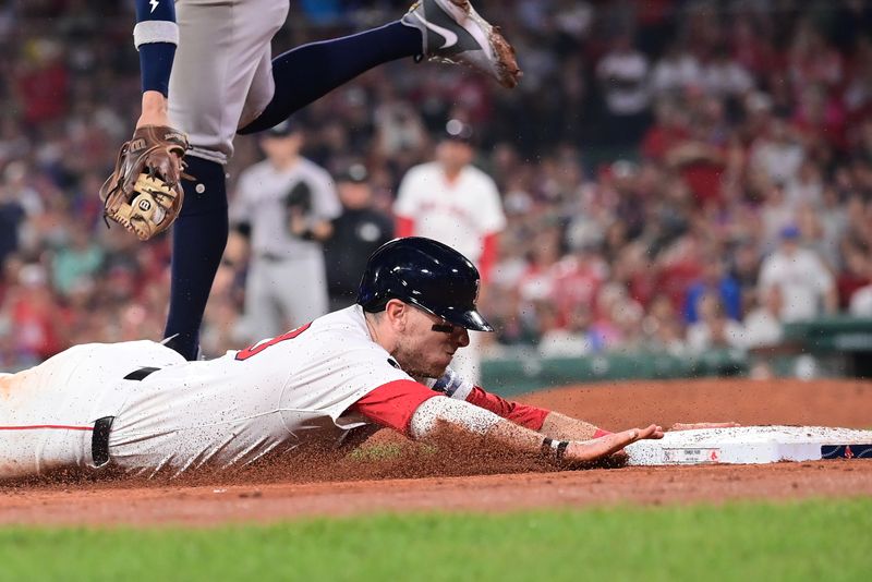 Jul 28, 2024; Boston, Massachusetts, USA; Boston Red Sox designated hitter Danny Jensen (28) dives for third base during the seventh inning against the New York Yankees at Fenway Park. Mandatory Credit: Eric Canha-USA TODAY Sports