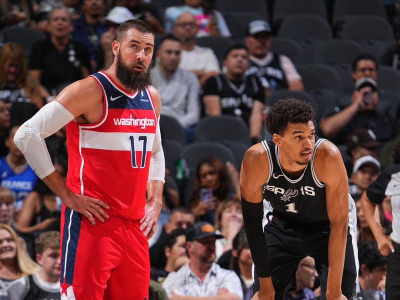 SAN ANTONIO, TX - NOVEMBER 13: Jonas Valanciunas #17 of the Washington Wizards and Victor Wembanyama #1 of the San Antonio Spurs look on during the game between the Washington Wizards and the San Antonio Spurs on November 13, 2024 at the Frost Bank Center in San Antonio, Texas. NOTE TO USER: User expressly acknowledges and agrees that, by downloading and or using this photograph, user is consenting to the terms and conditions of the Getty Images License Agreement. Mandatory Copyright Notice: Copyright 2024 NBAE (Photos byGarrett Ellwood/NBAE via Getty Images)