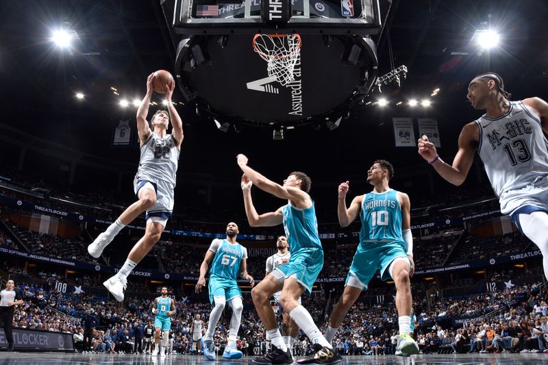 ORLANDO, FL - FEBRUARY 12: Franz Wagner #22 of the Orlando Magic drives to the basket during the game against the Charlotte Hornets on February 12, 2025 at Kia Center in Orlando, Florida. NOTE TO USER: User expressly acknowledges and agrees that, by downloading and or using this photograph, User is consenting to the terms and conditions of the Getty Images License Agreement. Mandatory Copyright Notice: Copyright 2025 NBAE (Photo by Fernando Medina/NBAE via Getty Images)