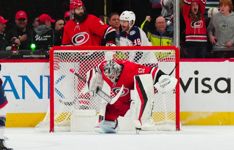 Nov 26, 2023; Raleigh, North Carolina, USA; Carolina Hurricanes goaltender Pyotr Kochetkov (52) celebrates the Hurricanes    win against the Columbus Blue Jackets at PNC Arena. Mandatory Credit: James Guillory-USA TODAY Sports