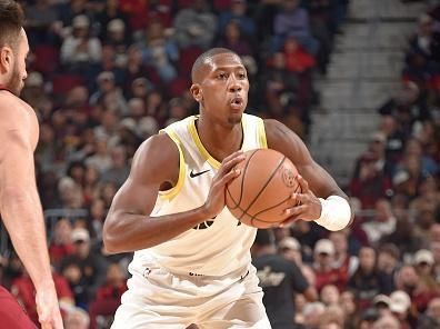 CLEVELAND, OH - DECEMBER 20: Kris Dunn #11 of the Utah Jazz looks to pass the ball during the game against the Cleveland Cavaliers on December 20, 2023 at Rocket Mortgage FieldHouse in Cleveland, Ohio. NOTE TO USER: User expressly acknowledges and agrees that, by downloading and/or using this Photograph, user is consenting to the terms and conditions of the Getty Images License Agreement. Mandatory Copyright Notice: Copyright 2023 NBAE (Photo by David Liam Kyle/NBAE via Getty Images)