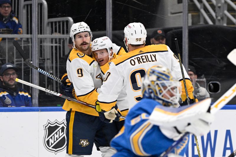 Feb 17, 2024; St. Louis, Missouri, USA; Nashville Predators left wing Filip Forsberg (9) is congratulated by teammates after scoring a goal against the St. Louis Blues during the third period at Enterprise Center. Mandatory Credit: Jeff Le-USA TODAY Sports