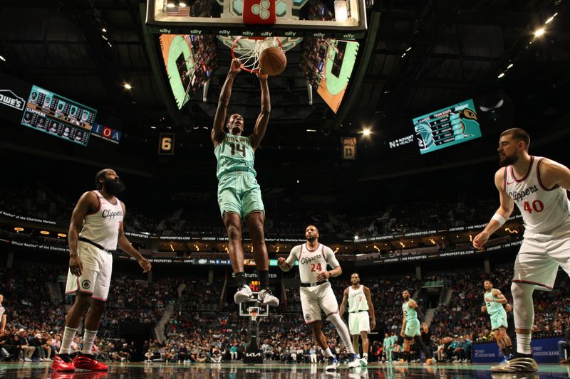 CHARLOTTE, NC - JANUARY 31:  Moussa Diabate #14 of the Charlotte Hornets dunks the ball during the game against the LA Clippers on January 31, 2025 at Spectrum Center in Charlotte, North Carolina. NOTE TO USER: User expressly acknowledges and agrees that, by downloading and or using this photograph, User is consenting to the terms and conditions of the Getty Images License Agreement. Mandatory Copyright Notice: Copyright 2025 NBAE (Photo by Kent Smith/NBAE via Getty Images)