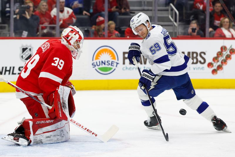 Jan 25, 2025; Detroit, Michigan, USA;  Detroit Red Wings goaltender Cam Talbot (39) makes a save on Tampa Bay Lightning center Jake Guentzel (59) in the first period at Little Caesars Arena. Mandatory Credit: Rick Osentoski-Imagn Images