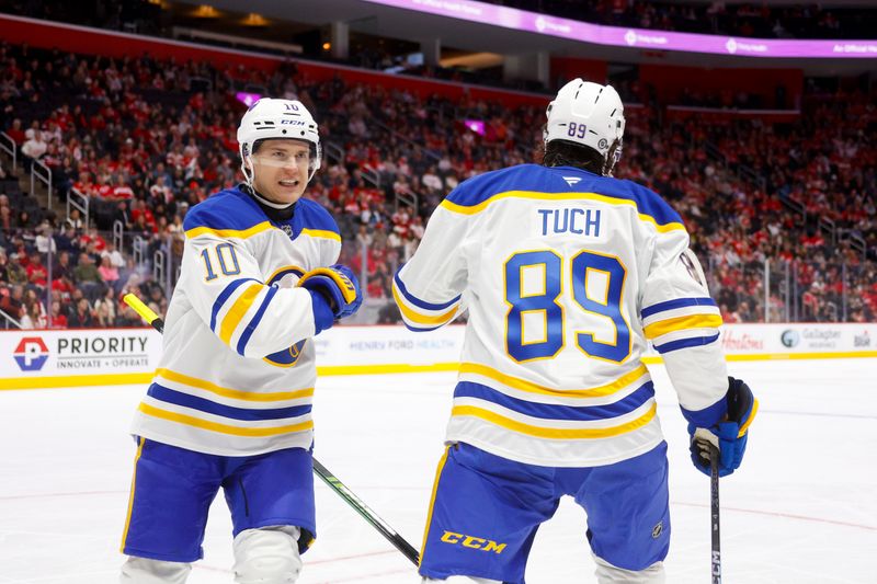 Nov 2, 2024; Detroit, Michigan, USA; Buffalo Sabres right wing Alex Tuch (89) celebrates a goal in the first period of the game against the Detroit Red Wings with Buffalo Sabres defenseman Henri Jokiharju (10) at Little Caesars Arena. Mandatory Credit: Brian Bradshaw Sevald-Imagn Images