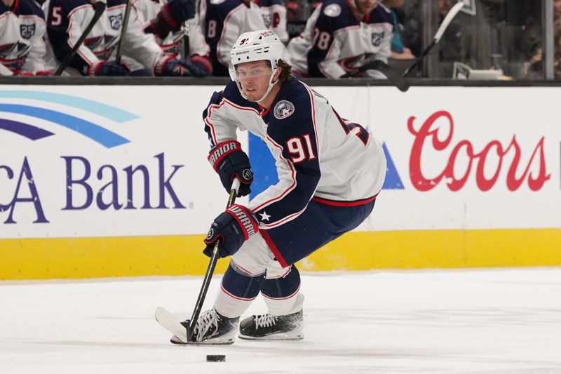 Jan 6, 2026; San Jose, California, USA;  Columbus Blue Jackets center Kent Johnson (91) controls the puck against the San Jose Sharks in the first period at SAP Center at San Jose. Mandatory Credit: David Gonzales-Imagn Images