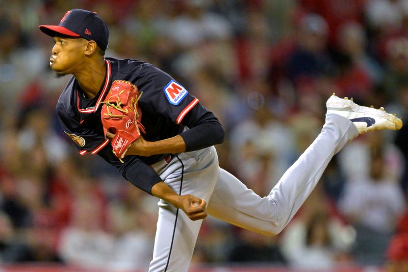 Apr 5, 2025; Anaheim, California, USA;Cleveland Guardians relief pitcher Triston McKenzie (24) delivers to the plate in the fifth inning against the Los Angeles Angels at Angel Stadium. Mandatory Credit: Jayne Kamin-Oncea-Imagn Images