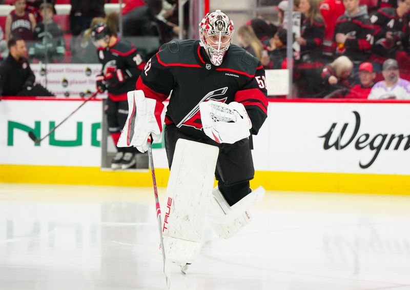 Apr 12, 2025; Raleigh, North Carolina, USA;  Carolina Hurricanes goaltender Pyotr Kochetkov (52) skates out onto the ice for warmups before the game against the New York Rangers at Lenovo Center. Mandatory Credit: James Guillory-Imagn Images