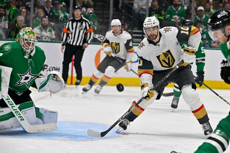 May 1, 2024; Dallas, Texas, USA; Vegas Golden Knights center Nicolas Roy (10) looks to redirect the puck past Dallas Stars goaltender Jake Oettinger (29) during the third period in game five of the first round of the 2024 Stanley Cup Playoffs at the American Airlines Center. Mandatory Credit: Jerome Miron-USA TODAY Sports