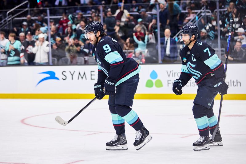 Dec 14, 2025; Seattle, Washington, USA;  Seattle Kraken center Chandler Stephenson (9) celebrates after scoring a goal during the second period against the Buffalo Sabres at Climate Pledge Arena. Mandatory Credit: Blake Dahlin-Imagn Images