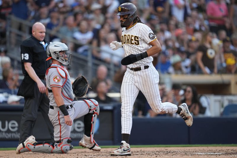 Aug 16, 2023; San Diego, California, USA;  San Diego Padres right fielder Fernando Tatis Jr. (23) scores on an RBI single by first baseman Jake Cronenworth (not pictured) during the third inning against the Baltimore Orioles at Petco Park. Mandatory Credit: Ray Acevedo-USA TODAY Sports