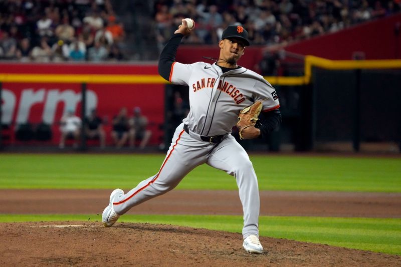 Jun 3, 2024; Phoenix, Arizona, USA; San Francisco Giants pitcher Randy Rodríguez (73) throws against the Arizona Diamondbacks in the ninth inning at Chase Field. Mandatory Credit: Rick Scuteri-USA TODAY Sports