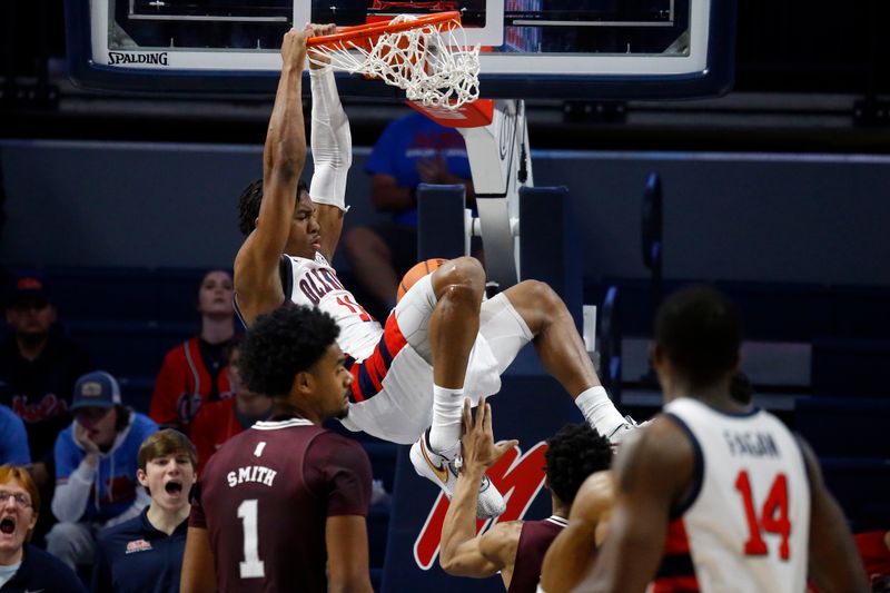 Feb 18, 2023; Oxford, Mississippi, USA; Mississippi Rebels guard Matthew Murrell (11) dunks during the first half against the Mississippi State Bulldogs at The Sandy and John Black Pavilion at Ole Miss. Mandatory Credit: Petre Thomas-USA TODAY Sports