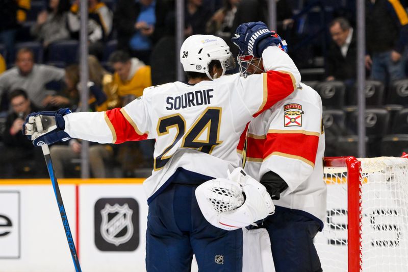 Feb 25, 2025; Nashville, Tennessee, USA;  Florida Panthers right wing Justin Sourdif (24) congratulates goaltender Spencer Knight (30) for the win against the Nashville Predators during the third half at Bridgestone Arena. Mandatory Credit: Steve Roberts-Imagn Images