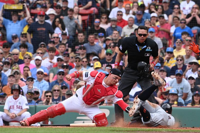 Jun 2, 2024; Boston, Massachusetts, USA;  Detroit Tigers right fielder Wenceel Perez (46) slides safe into home plate coved by Boston Red Sox catcher Reese McGuire (3) during the sixth inning at Fenway Park. Mandatory Credit: Eric Canha-USA TODAY Sports