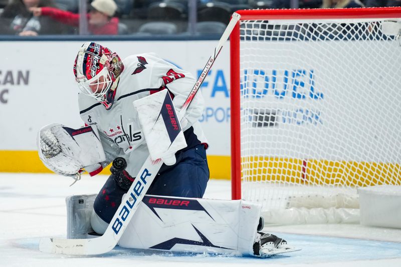 Sep 30, 2025; Columbus, Ohio, USA; Washington Capitals goaltender Logan Thompson (48) makes a save in net against the Columbus Blue Jackets in the third period at Nationwide Arena. Mandatory Credit: Aaron Doster-Imagn Images