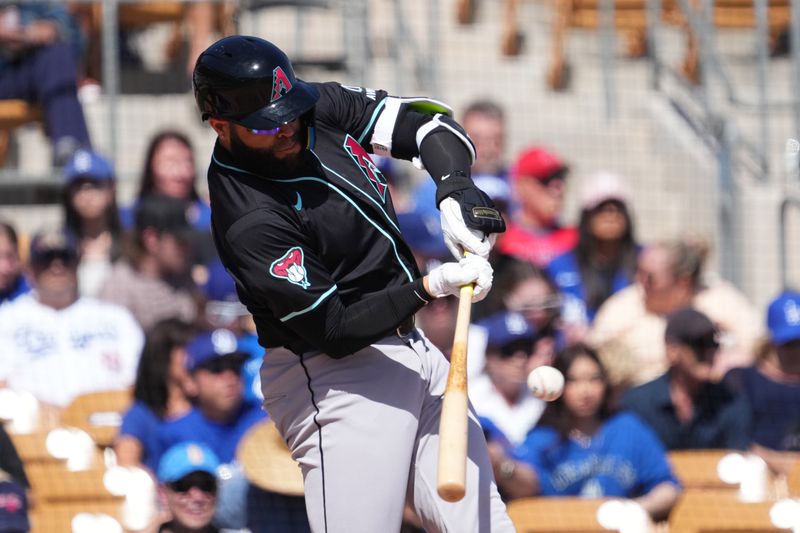 Mar 10, 2024; Phoenix, Arizona, USA; Arizona Diamondbacks first baseman Emmanuel Rivera (13) bats D during the second inning at Camelback Ranch-Glendale. Mandatory Credit: Joe Camporeale-USA TODAY Sports