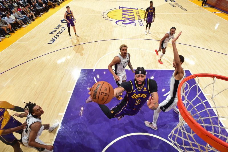 LOS ANGELES, CA - FEBRUARY 23: Anthony Davis #3 of the Los Angeles Lakers drives to the basket during the game against the San Antonio Spurs on Feburary 23, 2024 at Crypto.Com Arena in Los Angeles, California. NOTE TO USER: User expressly acknowledges and agrees that, by downloading and/or using this Photograph, user is consenting to the terms and conditions of the Getty Images License Agreement. Mandatory Copyright Notice: Copyright 2024 NBAE (Photo by Andrew D. Bernstein/NBAE via Getty Images)