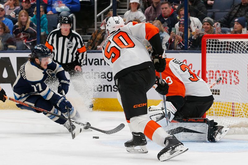 Apr 6, 2024; Columbus, Ohio, USA; Columbus Blue Jackets defenseman Nick Blankenburg (77) takes a shot on goal against the Philadelphia Flyers during the first period at Nationwide Arena. Mandatory Credit: Russell LaBounty-USA TODAY Sports