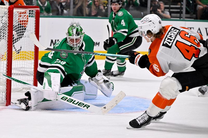 Nov 15, 2025; Dallas, Texas, USA; Dallas Stars goaltender Jake Oettinger (29) faces a shot by Philadelphia Flyers center Trevor Zegras (46) during the third period at the American Airlines Center. Mandatory Credit: Jerome Miron-Imagn Images