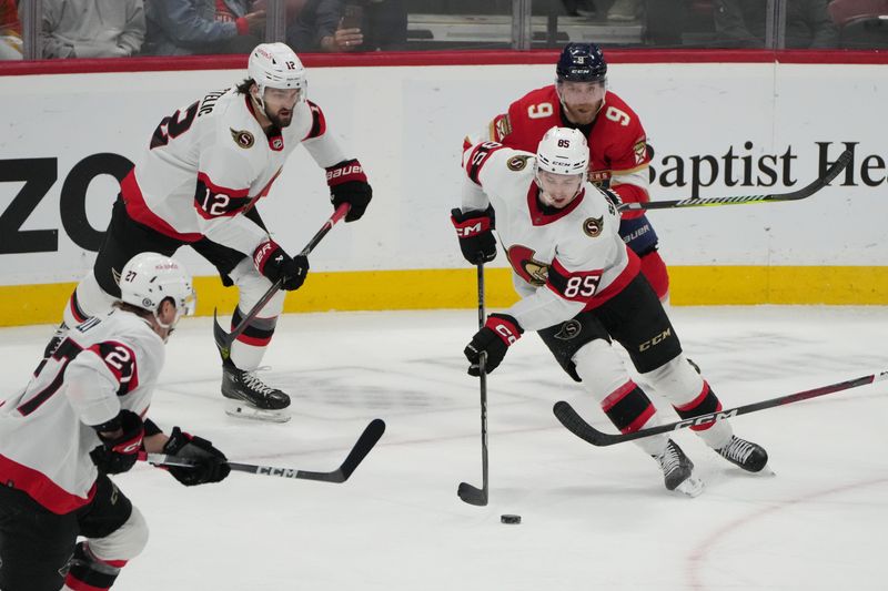 Feb 20, 2024; Sunrise, Florida, USA; Ottawa Senators defenseman Jake Sanderson (85) brings the puck up the ice against the Florida Panthers during the third period at Amerant Bank Arena. Mandatory Credit: Jim Rassol-USA TODAY Sports