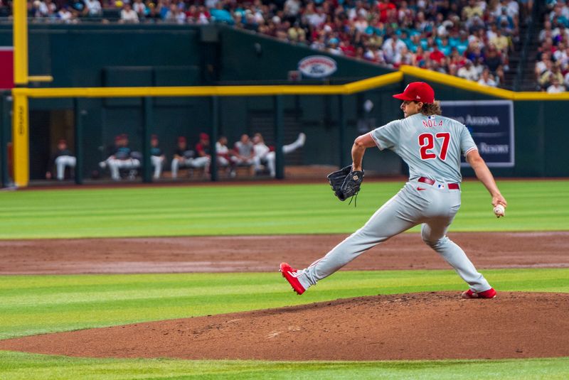 Aug 10, 2024; Phoenix, Arizona, USA; Philadelphia Phillies pitcher Aaron Nola (27) on the mound in the first inning for a game against the Arizona Diamondbacks at Chase Field. Mandatory Credit: Allan Henry-USA TODAY Sports 