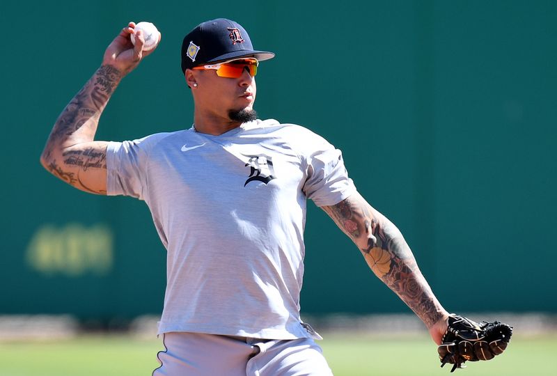 Mar 22, 2022; Clearwater, Florida, USA; Detroit Tigers shortstop Javier Baez (28) warms up before the start of the game against the Philadelphia Phillies during spring training at BayCare Ballpark. Mandatory Credit: Jonathan Dyer-USA TODAY Sports