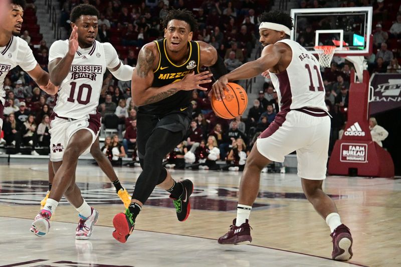 Feb 4, 2023; Starkville, Mississippi, USA; Missouri Tigers guard DeAndre Gholston (4) loses control of the ball to Mississippi State Bulldogs guard Eric Reed Jr. (11) during the first half  at Humphrey Coliseum. Mandatory Credit: Matt Bush-USA TODAY Sports