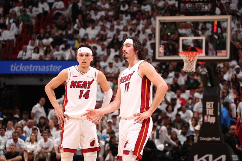 MIAMI, FL - APRIL 27: Jaime Jaquez Jr. #11 of the Miami Heat talks with Tyler Herro #14 during the game against the Boston Celtics during Round 1 Game 3 of the 2024 NBA Playoffs on April 27, 2024 at Kaseya Center in Miami, Florida. NOTE TO USER: User expressly acknowledges and agrees that, by downloading and or using this Photograph, user is consenting to the terms and conditions of the Getty Images License Agreement. Mandatory Copyright Notice: Copyright 2024 NBAE (Photo by Issac Baldizon/NBAE via Getty Images)