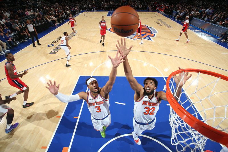 NEW YORK, NY - OCTOBER 9: Josh Hart #3 and Karl-Anthony Towns #32 of the New York Knicks go up for the rebound during the game against the Washington Wizards during the 2024 NBA Preseason on October 9, 2024 at Madison Square Garden in New York City, New York.  NOTE TO USER: User expressly acknowledges and agrees that, by downloading and or using this photograph, User is consenting to the terms and conditions of the Getty Images License Agreement. Mandatory Copyright Notice: Copyright 2024 NBAE  (Photo by Nathaniel S. Butler/NBAE via Getty Images)