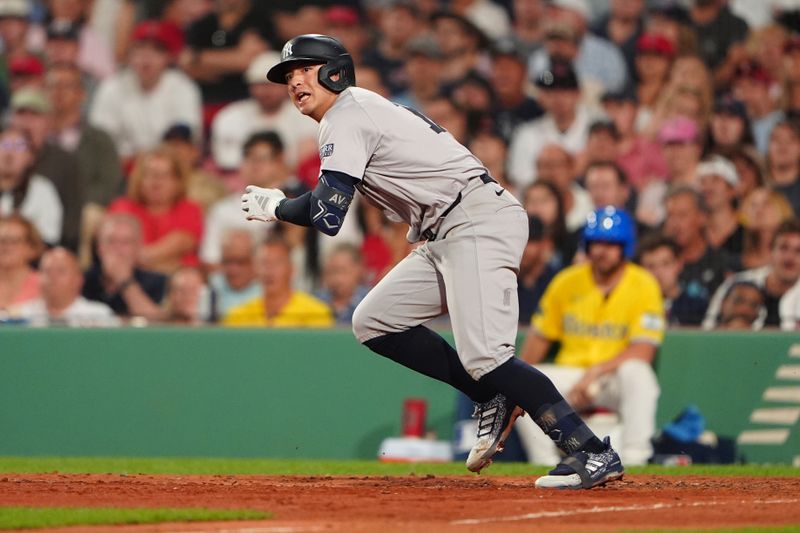 Jul 27, 2024; Boston, Massachusetts, USA; New York Yankees shortstop Anthony Volpe (11) runs out a single against the Boston Red Sox during the seventh inning at Fenway Park. Mandatory Credit: Gregory Fisher-USA TODAY Sports