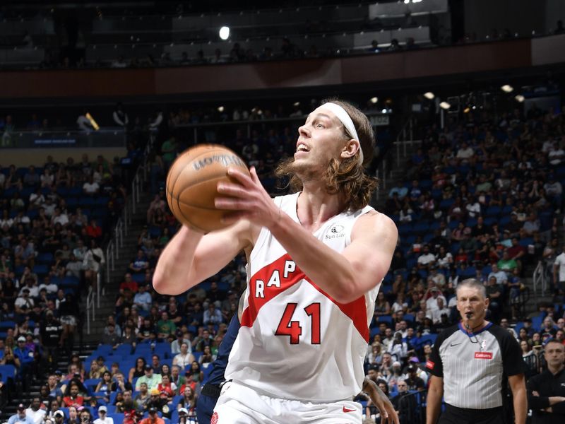 ORLANDO, FL - MARCH 17: Kelly Olynyk #41 of the Toronto Raptor drives to the basket during the game against the Orlando Magic on March 17, 2024 at the Kia Center in Orlando, Florida. NOTE TO USER: User expressly acknowledges and agrees that, by downloading and or using this photograph, User is consenting to the terms and conditions of the Getty Images License Agreement. Mandatory Copyright Notice: Copyright 2024 NBAE (Photo by Fernando Medina/NBAE via Getty Images)