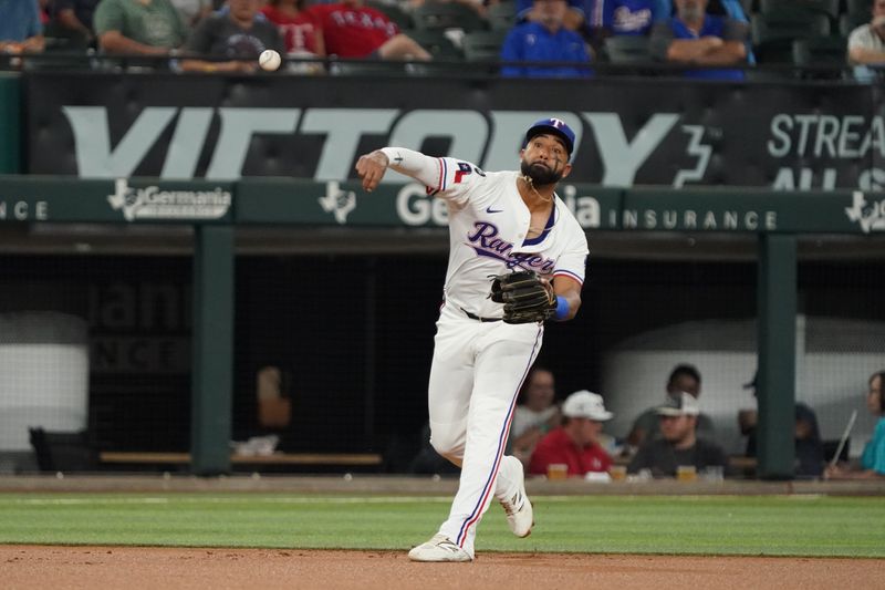 Sep 23, 2025; Arlington, Texas, USA; Texas Rangers shortstop Ezequiel Duran (20) throws to first base during the first inning against the Minnesota Twins at Globe Life Field. Mandatory Credit: Raymond Carlin III-Imagn Images