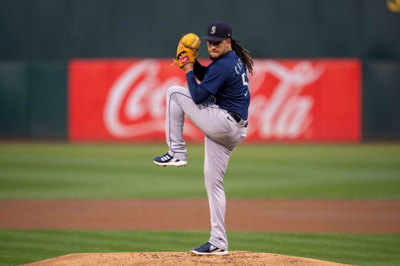 Sep 19, 2023; Oakland, California, USA; Seattle Mariners starting pitcher Luis Castillo (58) delivers a pitch against the Oakland Athletics during the first inning at Oakland-Alameda County Coliseum. Mandatory Credit: Neville E. Guard-USA TODAY Sports