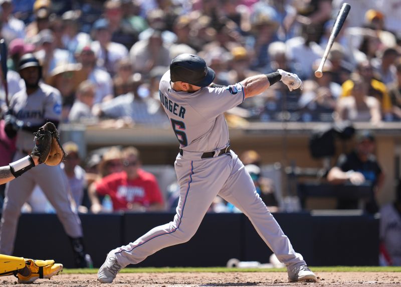 Aug 23, 2023; San Diego, California, USA;  Miami Marlins third baseman Jake Burger (36) lets his bat fly against the San Diego Padres during the sixth inning at Petco Park. Mandatory Credit: Ray Acevedo-USA TODAY Sports