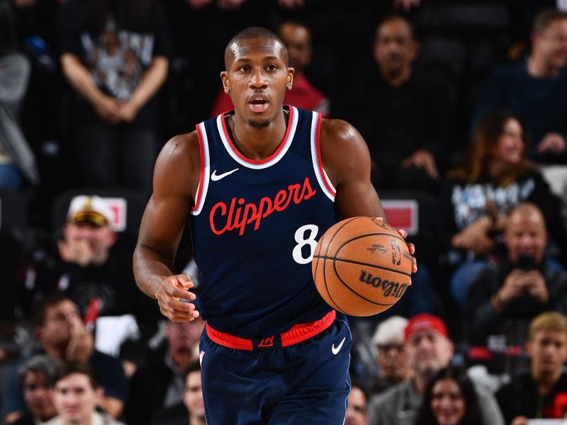 INGLEWOOD, CA - APRIL 26:  Kris Dunn #8 of the LA Clippers dribbles the ball during Round One, Game Four of the 2025 NBA Playoffs on April 26, 2025 at Intuit Dome in Los Angeles, California. NOTE TO USER: User expressly acknowledges and agrees that, by downloading and/or using this Photograph, user is consenting to the terms and conditions of the Getty Images License Agreement. Mandatory Copyright Notice: Copyright 2025 NBAE (Photo by Juan Ocampo/NBAE via Getty Images)