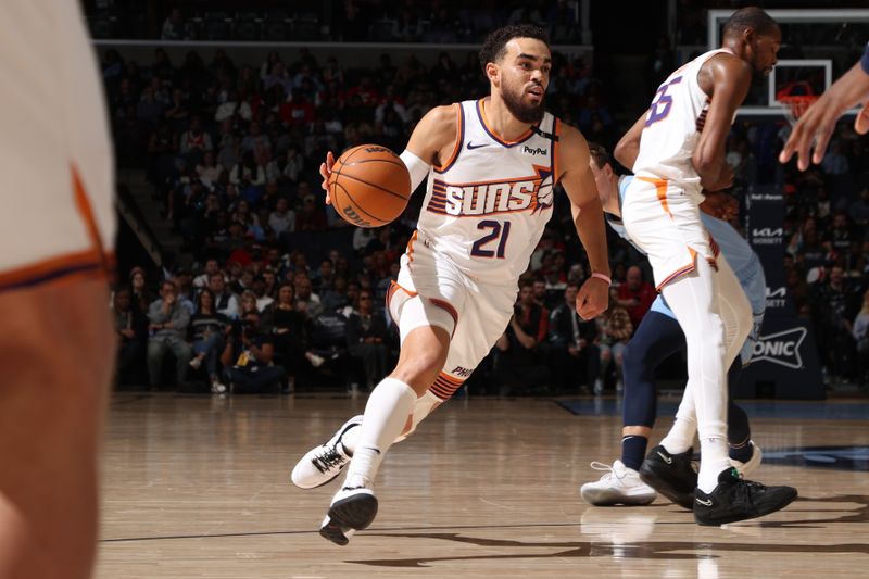 MEMPHIS, TN - FEBRUARY 25: Tyus Jones #21 of the Phoenix Suns handles the ball during the game against the Memphis Grizzlies on February 25, 2025 at FedExForum in Memphis, Tennessee. NOTE TO USER: User expressly acknowledges and agrees that, by downloading and or using this photograph, User is consenting to the terms and conditions of the Getty Images License Agreement. Mandatory Copyright Notice: Copyright 2025 NBAE (Photo by Joe Murphy/NBAE via Getty Images)