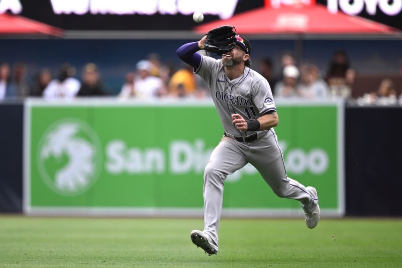 May 15, 2024; San Diego, California, USA; Colorado Rockies right fielder Jake Cave (11) catches a fly ball during the seventh inning against the San Diego Padres at Petco Park. Mandatory Credit: Orlando Ramirez-USA TODAY Sports