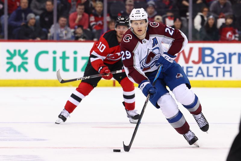 Feb 6, 2024; Newark, New Jersey, USA; Colorado Avalanche center Nathan MacKinnon (29) skates with the puck against the New Jersey Devils during the first period at Prudential Center. Mandatory Credit: Ed Mulholland-USA TODAY Sports