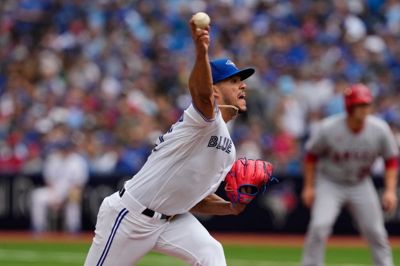 Jul 30, 2023; Toronto, Ontario, CAN; Toronto Blue Jays starting pitcher Jose Berrios (17) pitches to the Los Angeles Angels during the third inning at Rogers Centre. Mandatory Credit: John E. Sokolowski-USA TODAY Sports