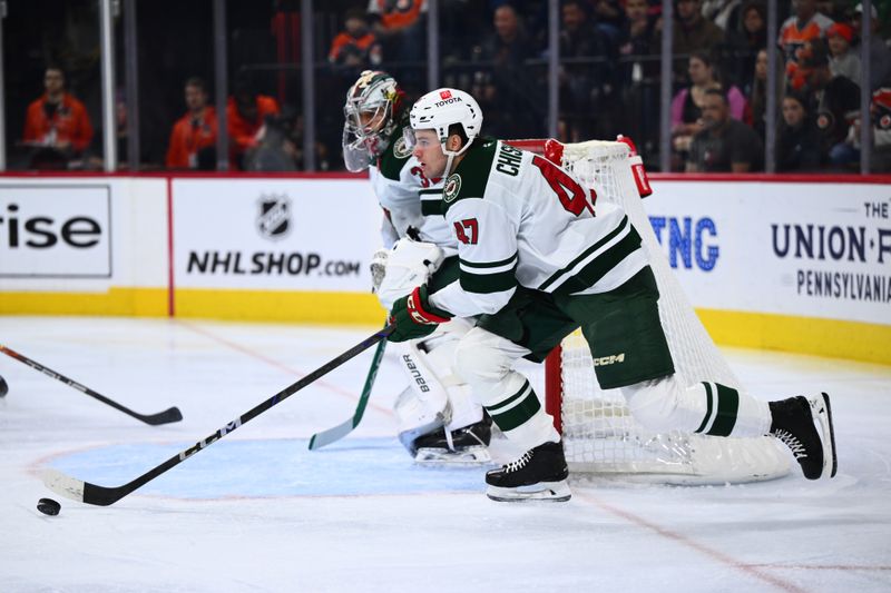 Oct 26, 2024; Philadelphia, Pennsylvania, USA; Minnesota Wild defenseman Declan Chisholm (47) controls the puck against the Philadelphia Flyers in the first period at Wells Fargo Center. Mandatory Credit: Kyle Ross-Imagn Images