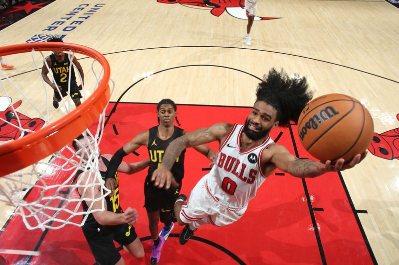 CHICAGO, IL - NOVEMBER 4: Coby White #0 of the Chicago Bulls drives to the basket during the game against the Utah Jazz on NOVEMBER 4, 2024 at United Center in Chicago, Illinois. NOTE TO USER: User expressly acknowledges and agrees that, by downloading and or using this photograph, User is consenting to the terms and conditions of the Getty Images License Agreement. Mandatory Copyright Notice: Copyright 2024 NBAE (Photo by Gary Dineen/NBAE via Getty Images)