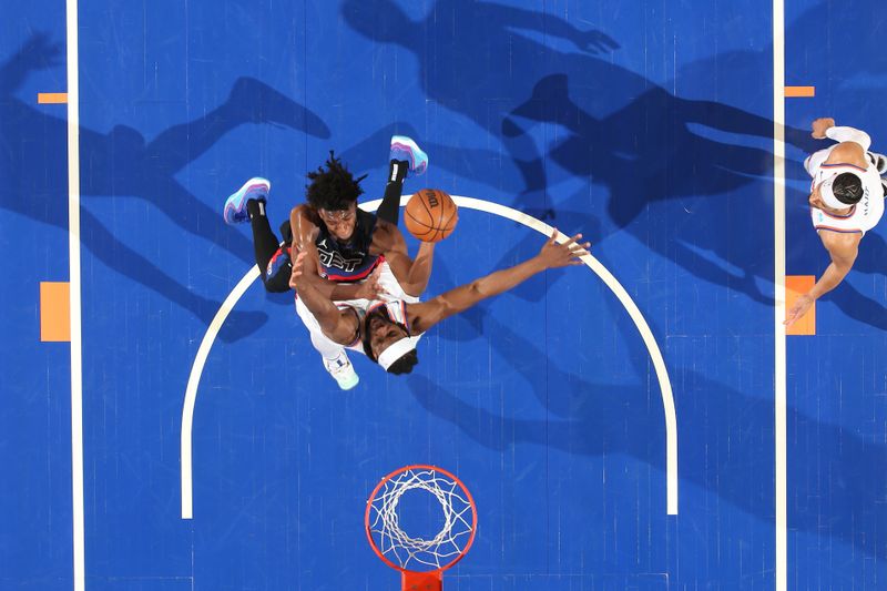 NEW YORK, NY - MARCH 25:  James Wiseman #13 of the Detroit Pistons drives to the basket during the game as Precious Achiuwa #5 of the New York Knicks plays defense on March 25, 2024 at Madison Square Garden in New York City, New York.  NOTE TO USER: User expressly acknowledges and agrees that, by downloading and or using this photograph, User is consenting to the terms and conditions of the Getty Images License Agreement. Mandatory Copyright Notice: Copyright 2024 NBAE  (Photo by David L. Nemec /NBAE via Getty Images)