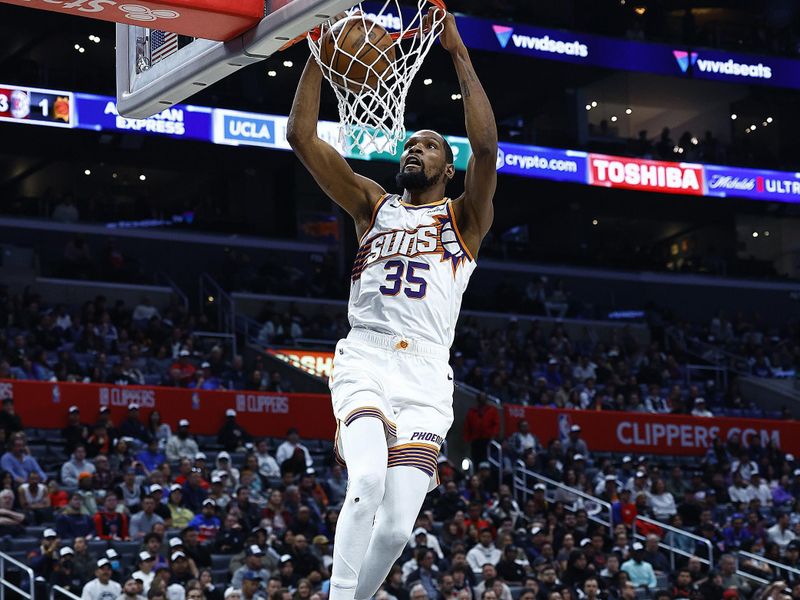 LOS ANGELES, CALIFORNIA - JANUARY 08:  Kevin Durant #35 of the Phoenix Suns makes a slam dunk against the LA Clippers in the second half at Crypto.com Arena on January 08, 2024 in Los Angeles, California.  NOTE TO USER: User expressly acknowledges and agrees that, by downloading and/or using this photograph, user is consenting to the terms and conditions of the Getty Images License Agreement.  (Photo by Ronald Martinez/Getty Images)