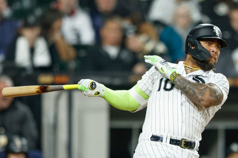 May 13, 2023; Chicago, Illinois, USA; Chicago White Sox third baseman Yoan Moncada (10) doubles against the Houston Astros during the eighth inning at Guaranteed Rate Field. Mandatory Credit: Kamil Krzaczynski-USA TODAY Sports