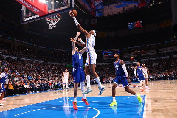 OKLAHOMA CITY, OK - DECEMBER 21: Aaron Wiggins #21 of the Oklahoma City Thunder shoots the ball during the game against the LA Clippers on December 21, 2023 at Paycom Arena in Oklahoma City, Oklahoma. NOTE TO USER: User expressly acknowledges and agrees that, by downloading and or using this photograph, User is consenting to the terms and conditions of the Getty Images License Agreement. Mandatory Copyright Notice: Copyright 2023 NBAE (Photo by Zach Beeker/NBAE via Getty Images)