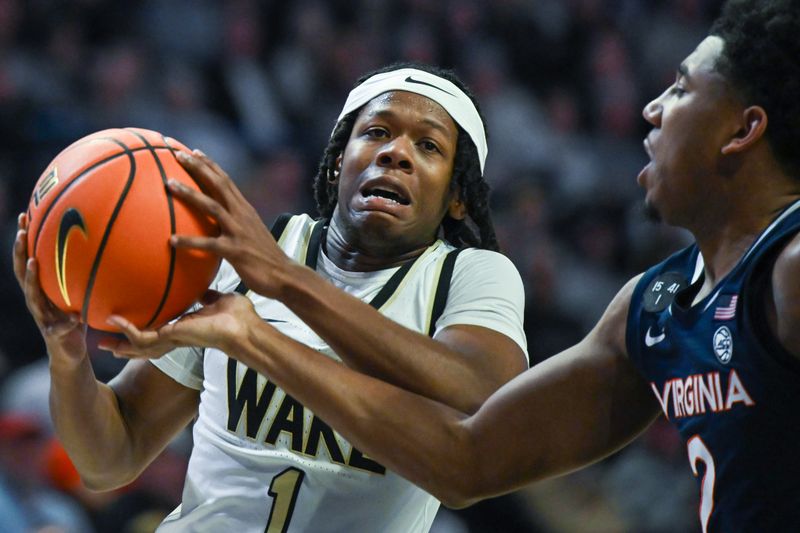 Jan 21, 2023; Winston-Salem, North Carolina, USA; Wake Forest Demon Deacons guard Tyree Appleby (1) drives around Virginia Cavaliers guard Reece Beekman (2) during the first half at Lawrence Joel Veterans Memorial Coliseum. Mandatory Credit: William Howard-USA TODAY Sports