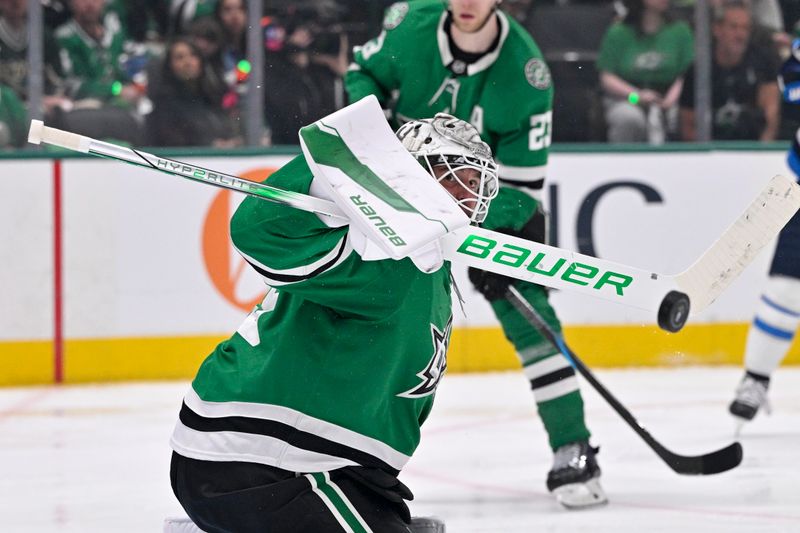 May 11, 2025; Dallas, Texas, USA; Dallas Stars goaltender Jake Oettinger (29) makes a stick save on a Winnipeg Jets shot during the third period in game three of the second round of the 2025 Stanley Cup Playoffs at American Airlines Center. Mandatory Credit: Jerome Miron-Imagn Images