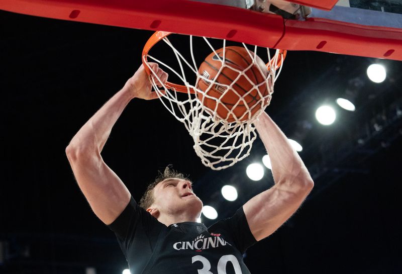 Jan 28, 2023; Houston, Texas, USA; Cincinnati Bearcats forward Viktor Lakhin (30) dunks against the Houston Cougars in the second half at Fertitta Center. Houston Cougars won 75 to 69 .Mandatory Credit: Thomas Shea-USA TODAY Sports