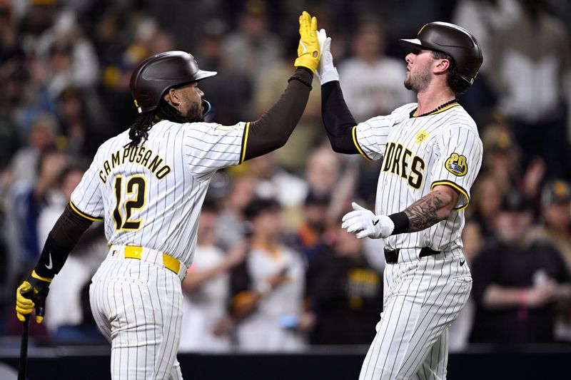 May 13, 2024; San Diego, California, USA; San Diego Padres center fielder Jackson Merrill (right) is congratulated by catcher Luis Campusano (12) after hitting a home run during the seventh inning against the Colorado Rockies at Petco Park. Mandatory Credit: Orlando Ramirez-USA TODAY Sports